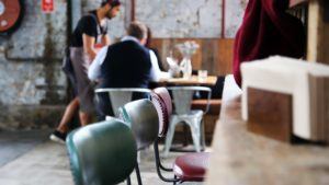 Branding - waiter serving customers in restaurant