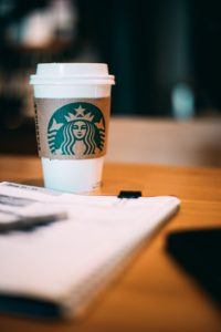 Branding - Starbucks cup on table with planner