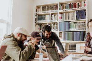 Branding - team of employees in office laughing