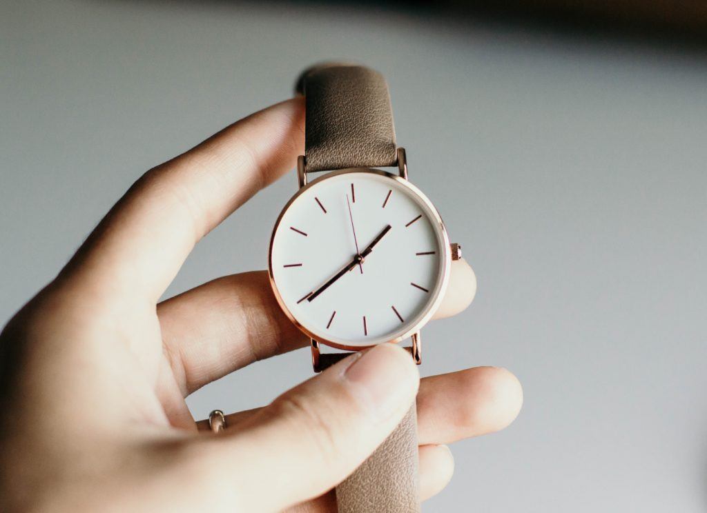 customer relationships - woman holding watch