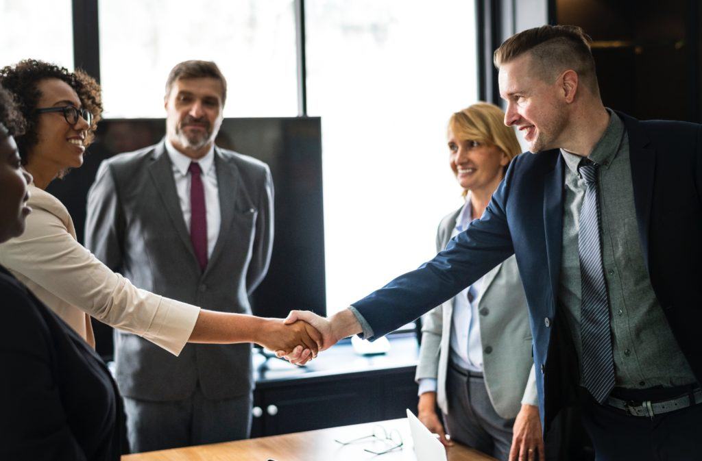 stronger customer relationships - colleagues shaking hands